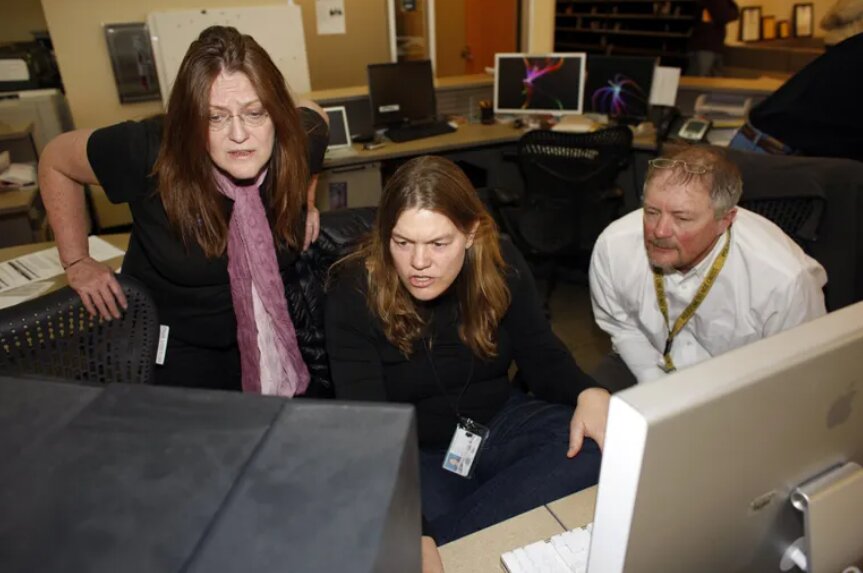 The Rocky Mountain News, which was launched in 1859, became a casualty of the news industry’s troubles when it closed in 2009. Pictured are freelance photographer Linda McConnell, left, photographer Judy Dehaas and photo editor Dean Krakel in the newsroom. (David Zalubowski / AP, 2009)